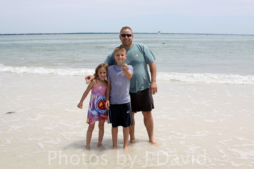 Family on a dolphin beach cruise